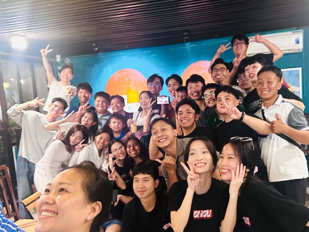 Young adults smiling for a photo at the coffee shop church