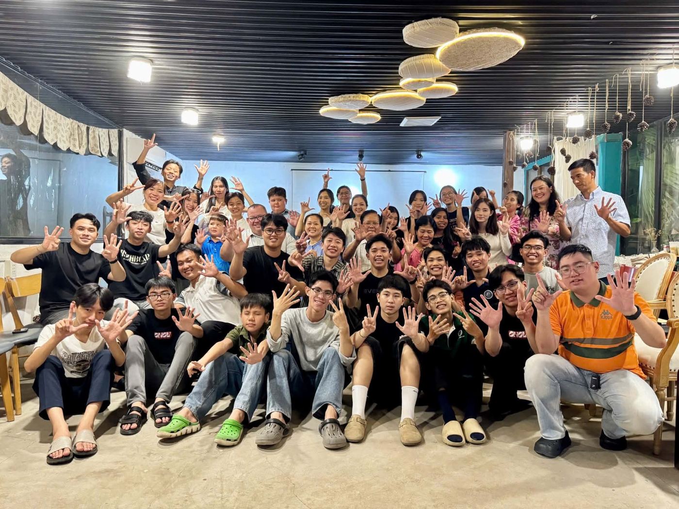 Young adults at the first service of a new coffee shop church in the Mekong Delta