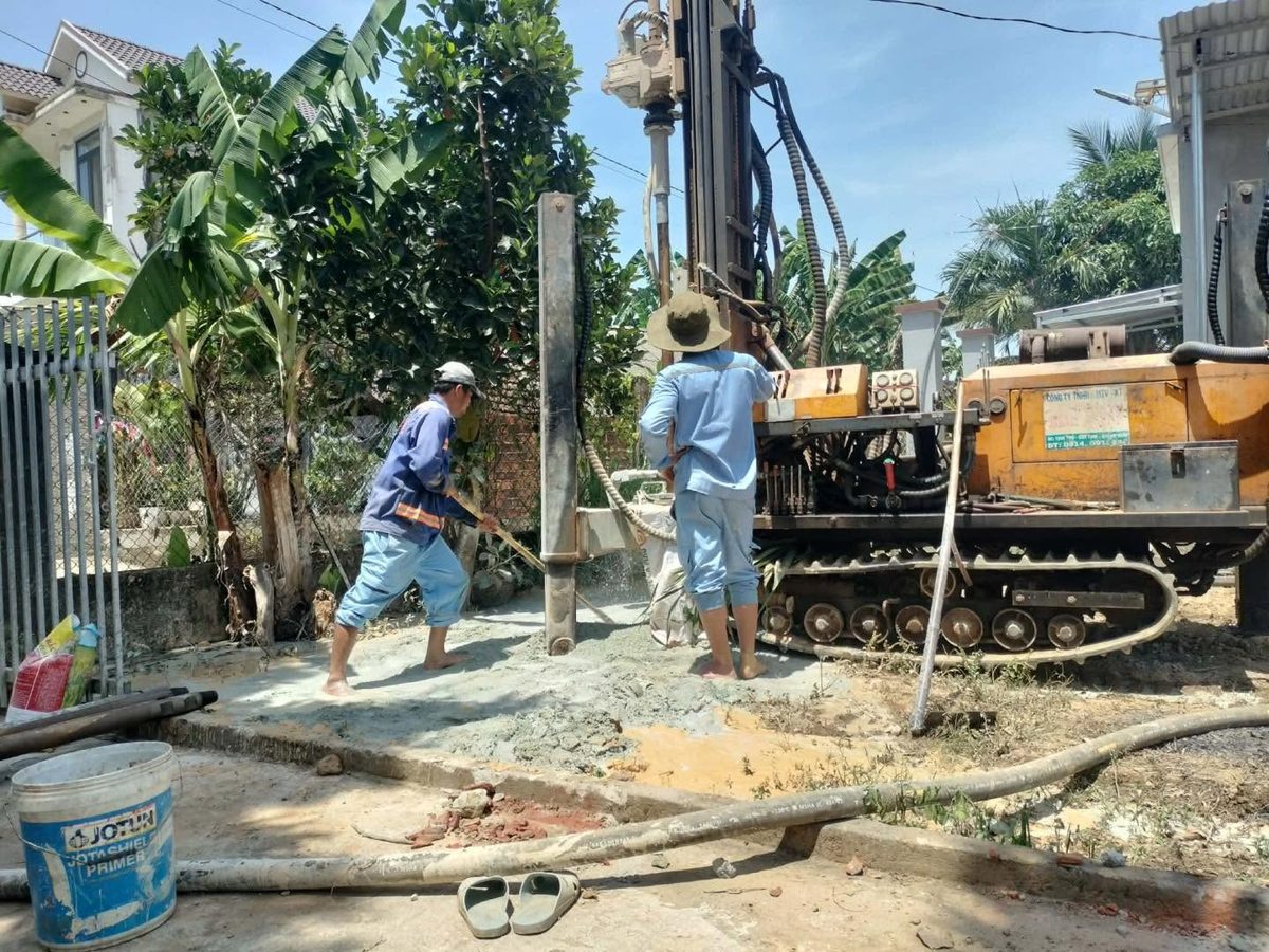 Workers drilling Pastor Quang’s new deep well