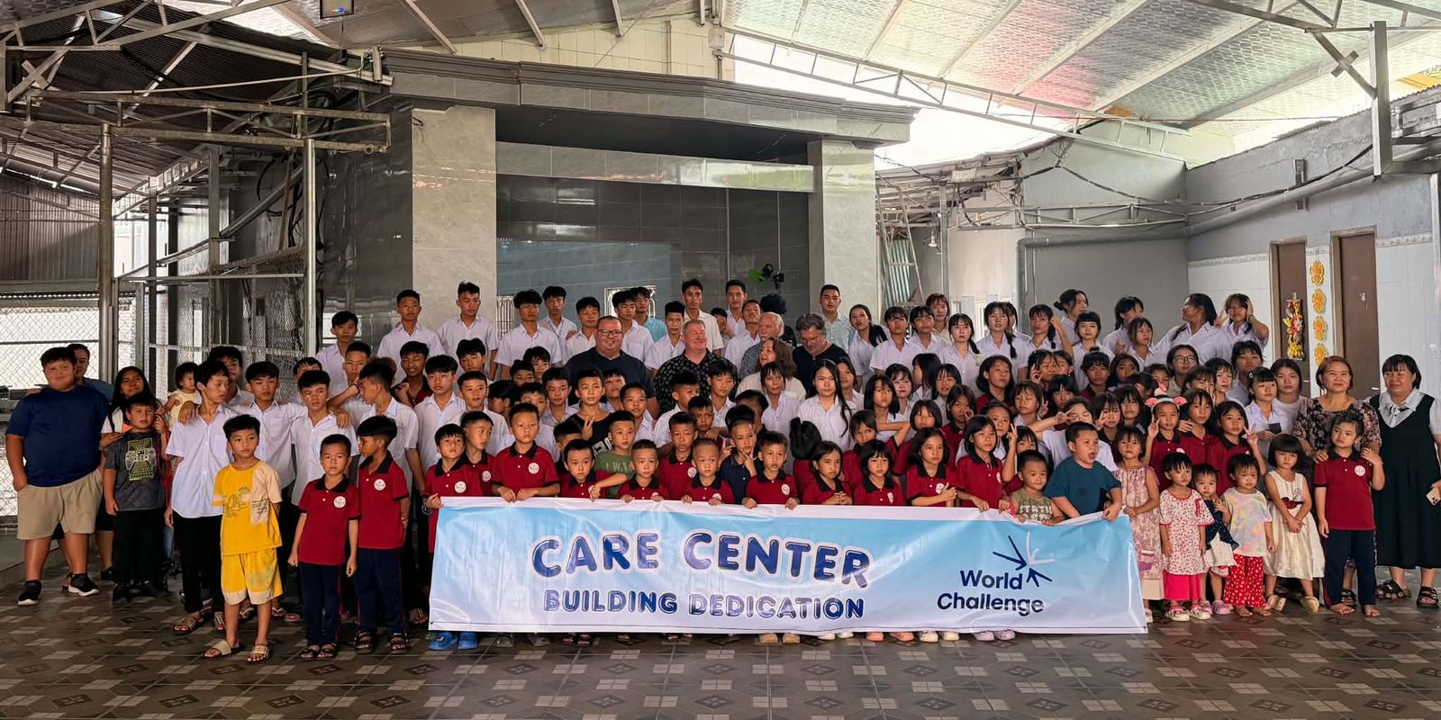 More than 135 children with Dr. Shaun, Pastor Gary Wilkerson and the World Challenge team at the Care Center building dedication