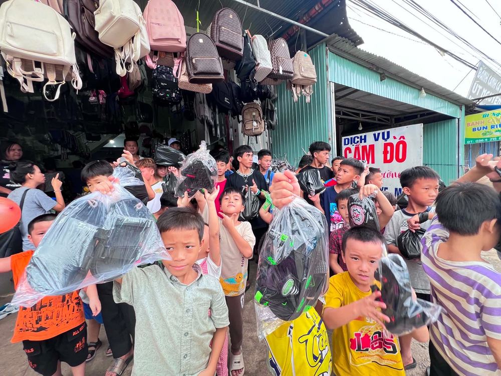 Children carrying their new backpacks