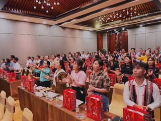 Pastors standing in worship at their tables