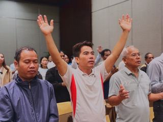 Pastors raising their hands in worship