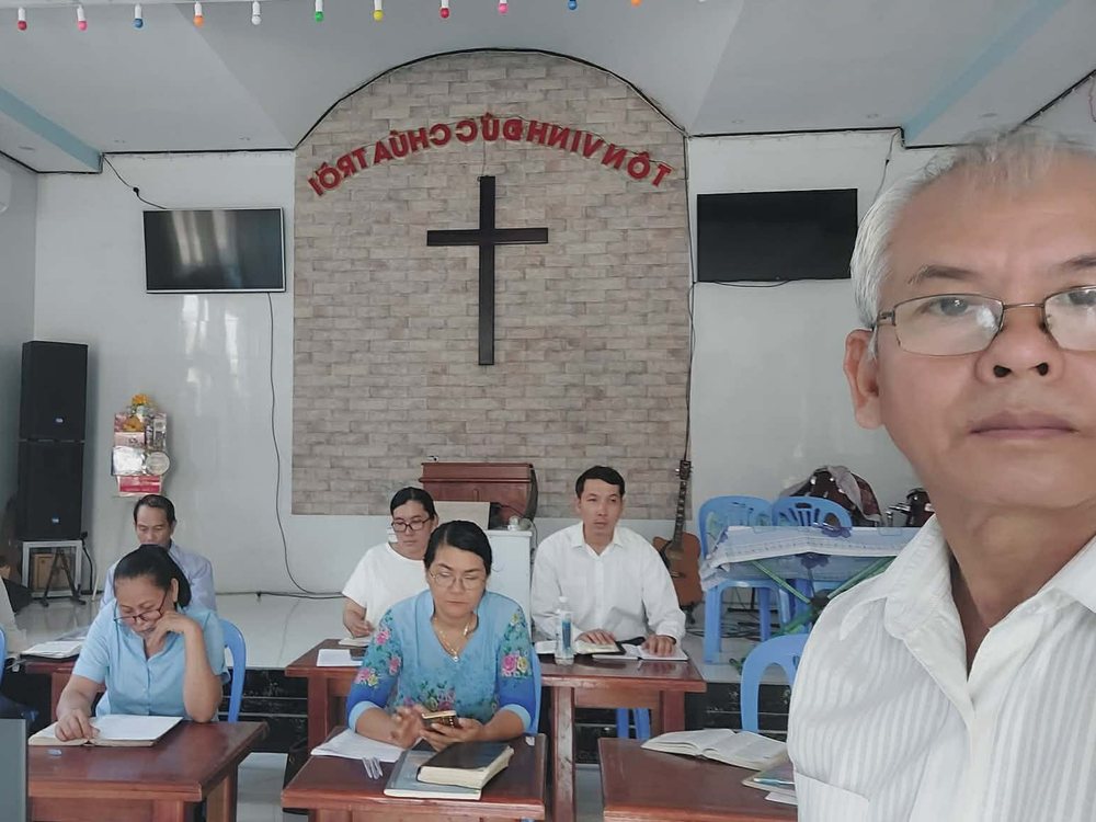 Church leaders studying at their desks during a training class