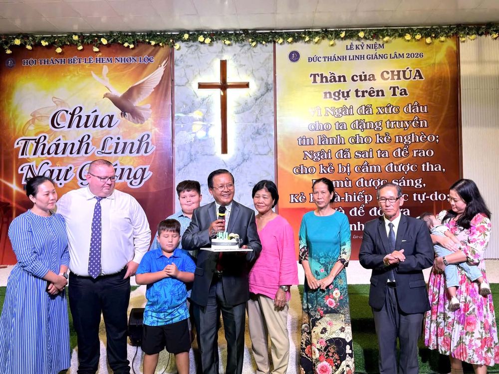Dr. Shaun and Liên with church leaders at the front of the church