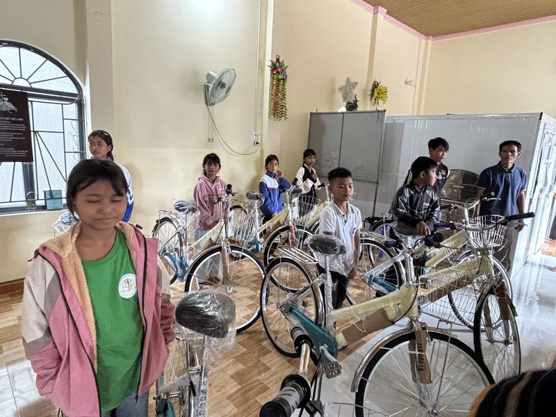 Children standing with their new bikes