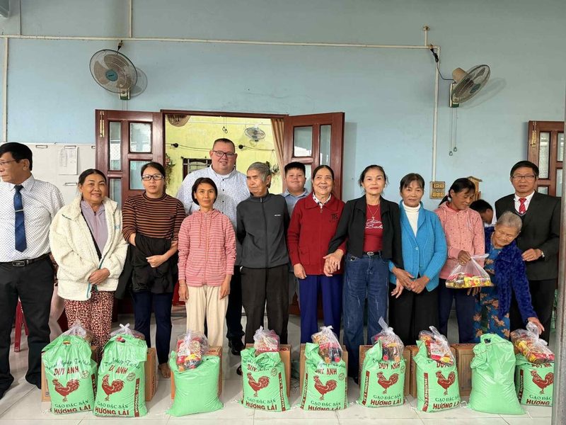 Widows receiving rice and food bags at a church