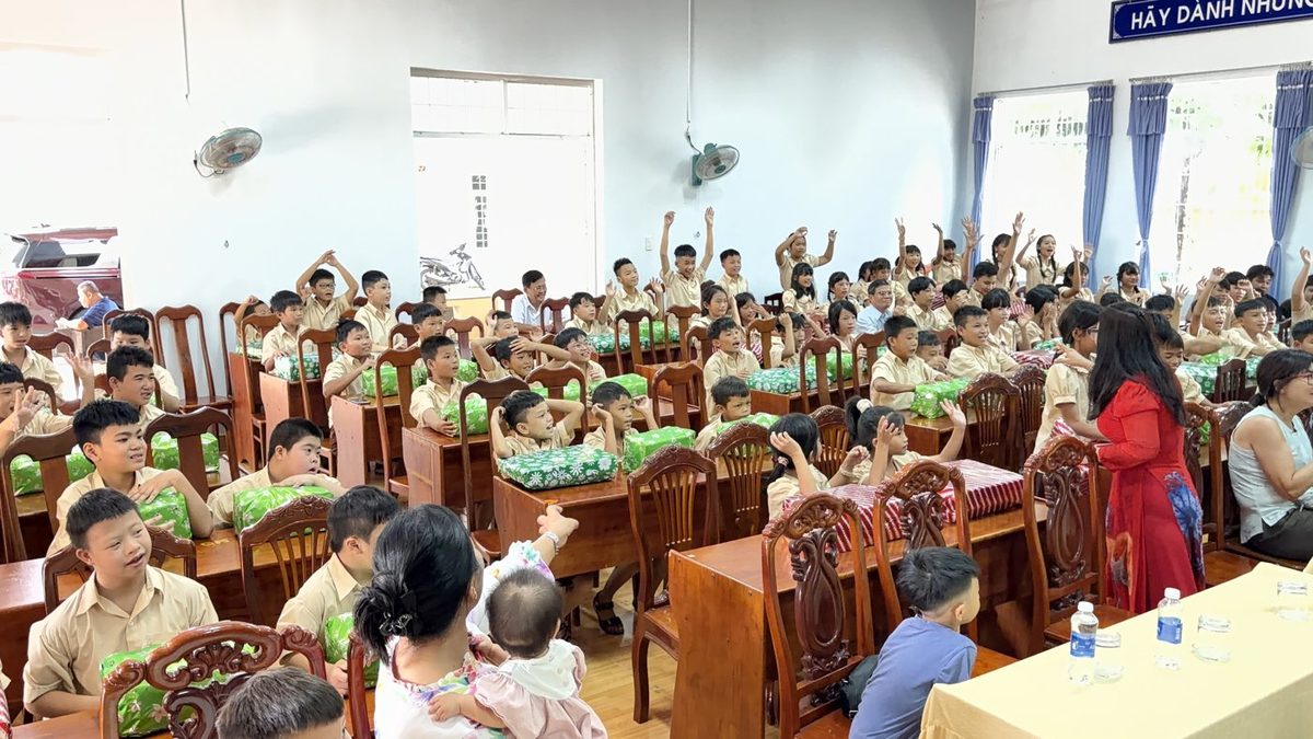 Orphanage children celebrating their Christmas party with wrapped gifts