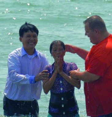 Photo from the report: Baptizing New Believers